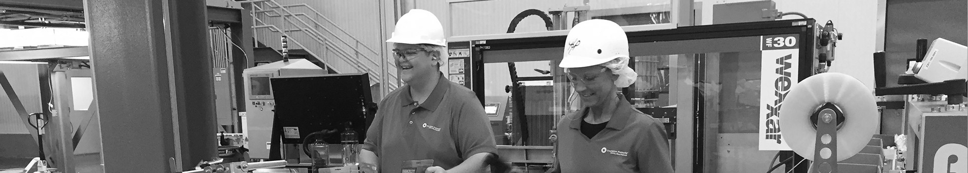 Walter and Kim on the packaging line, DogStar Kitchens